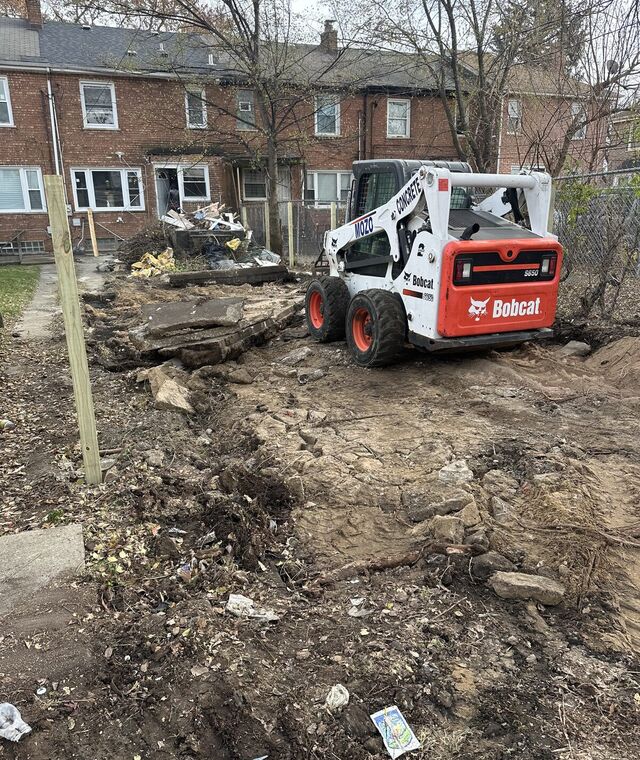 Torn-up side yard before work began