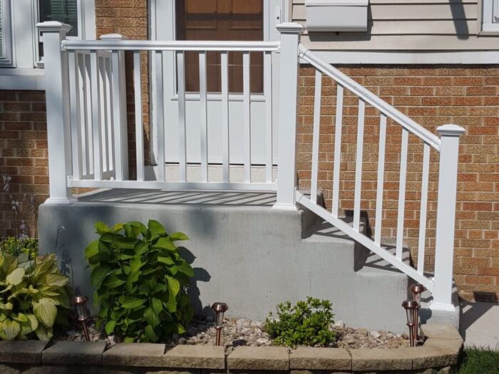 Front entry steps with a new railing