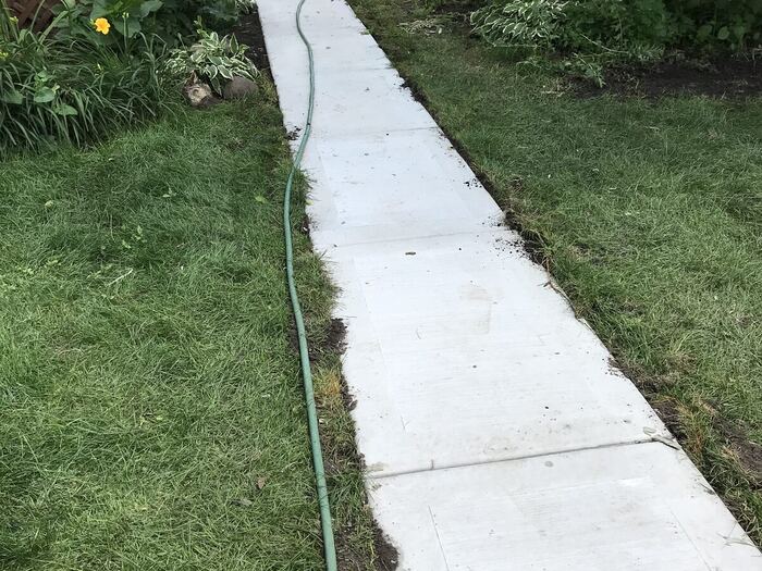 Curved walkway through the garden