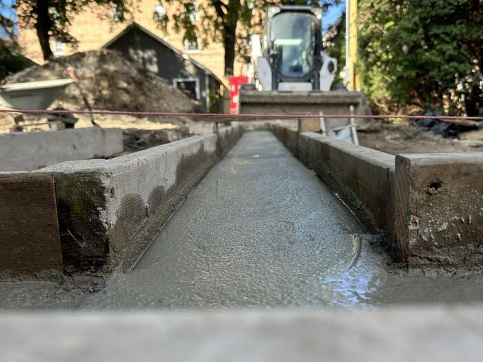 Sidewalk poured between homes